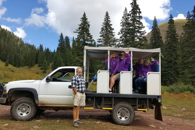 a man riding on the back of a truck