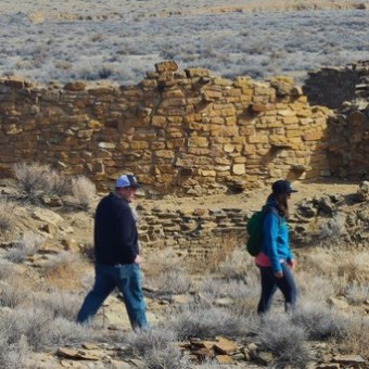 a group of people standing on a rock
