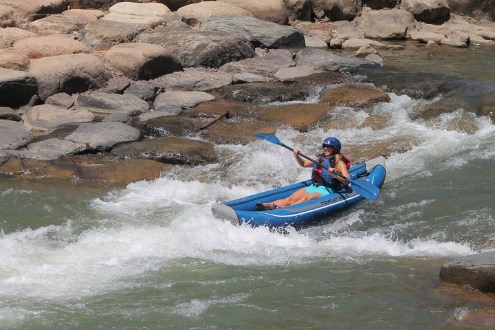 a person on a raft in a body of water
