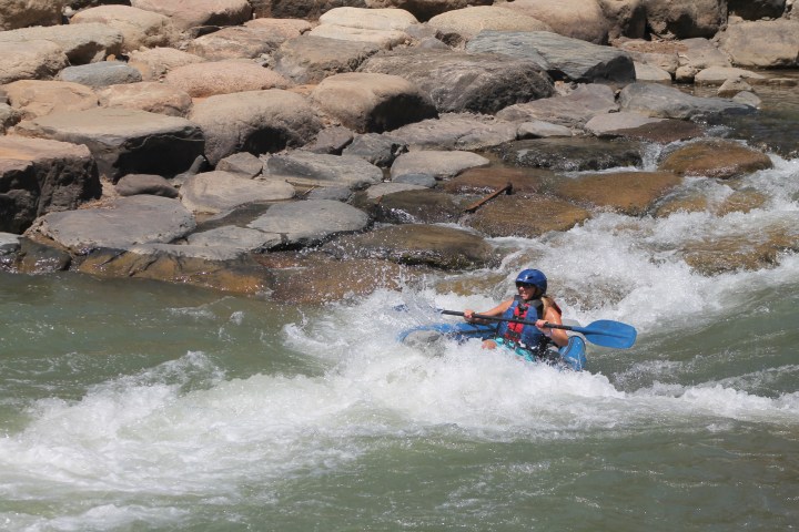 a man riding a wave on top of a body of water