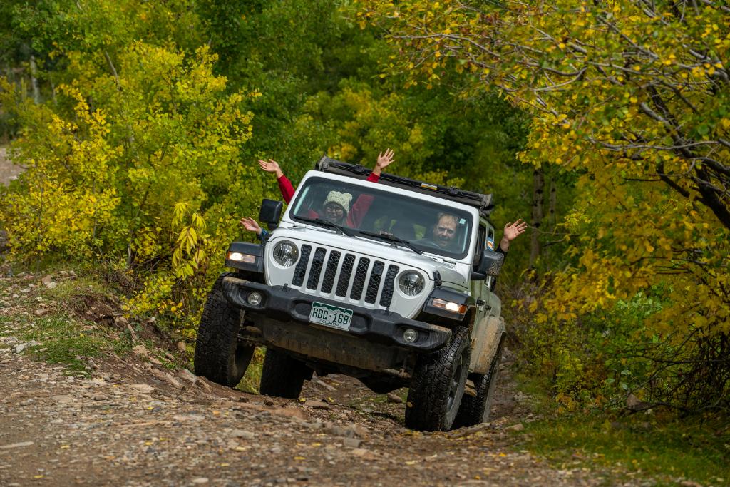 Jeeping OHV in La Plata Canyon During the Fall (1) a car parked on pavement near a forest