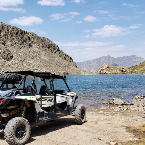 a truck with a mountain in the desert