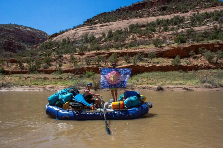 a man lying on a raft in a body of water