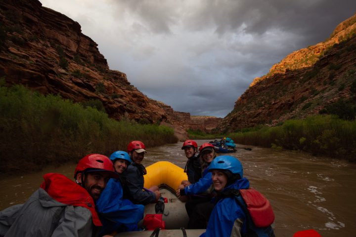 a group of people standing on top of a mountain