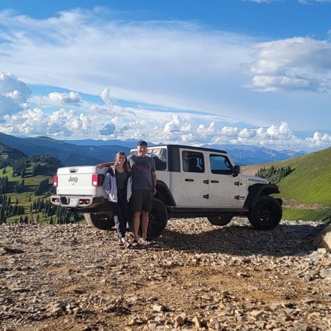 a truck with a mountain in the desert