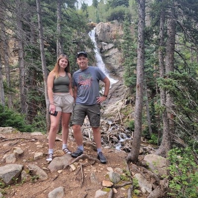 Deke Dickerson standing on a rock