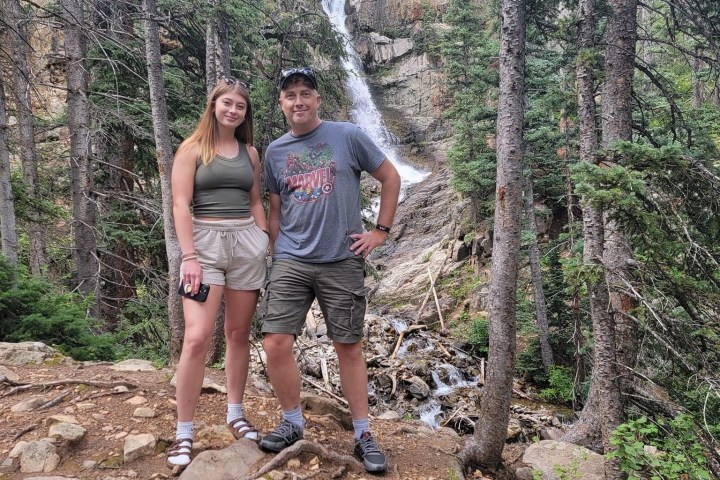 Deke Dickerson standing on a rock