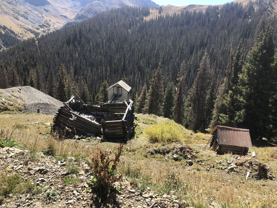 a man standing in front of a mountain