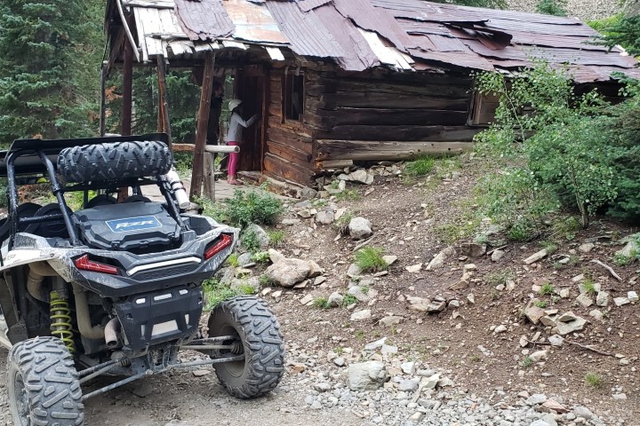 a car parked on a dirt road