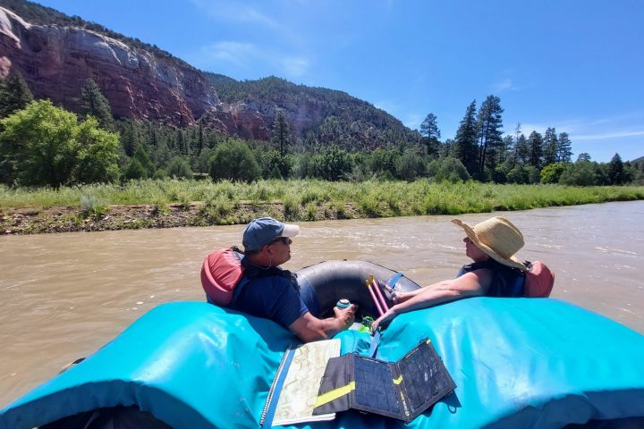 a group of people sitting on top of a mountain