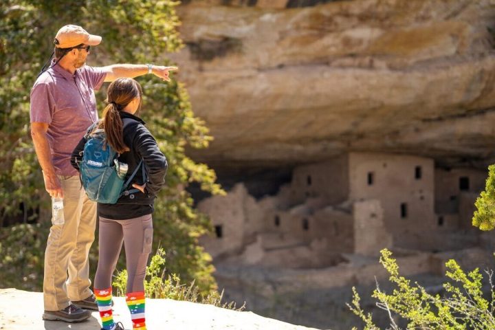 a person riding a skate board on a rock