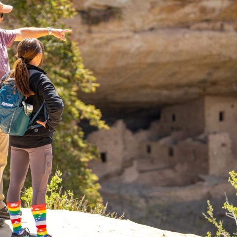a person standing on a rock